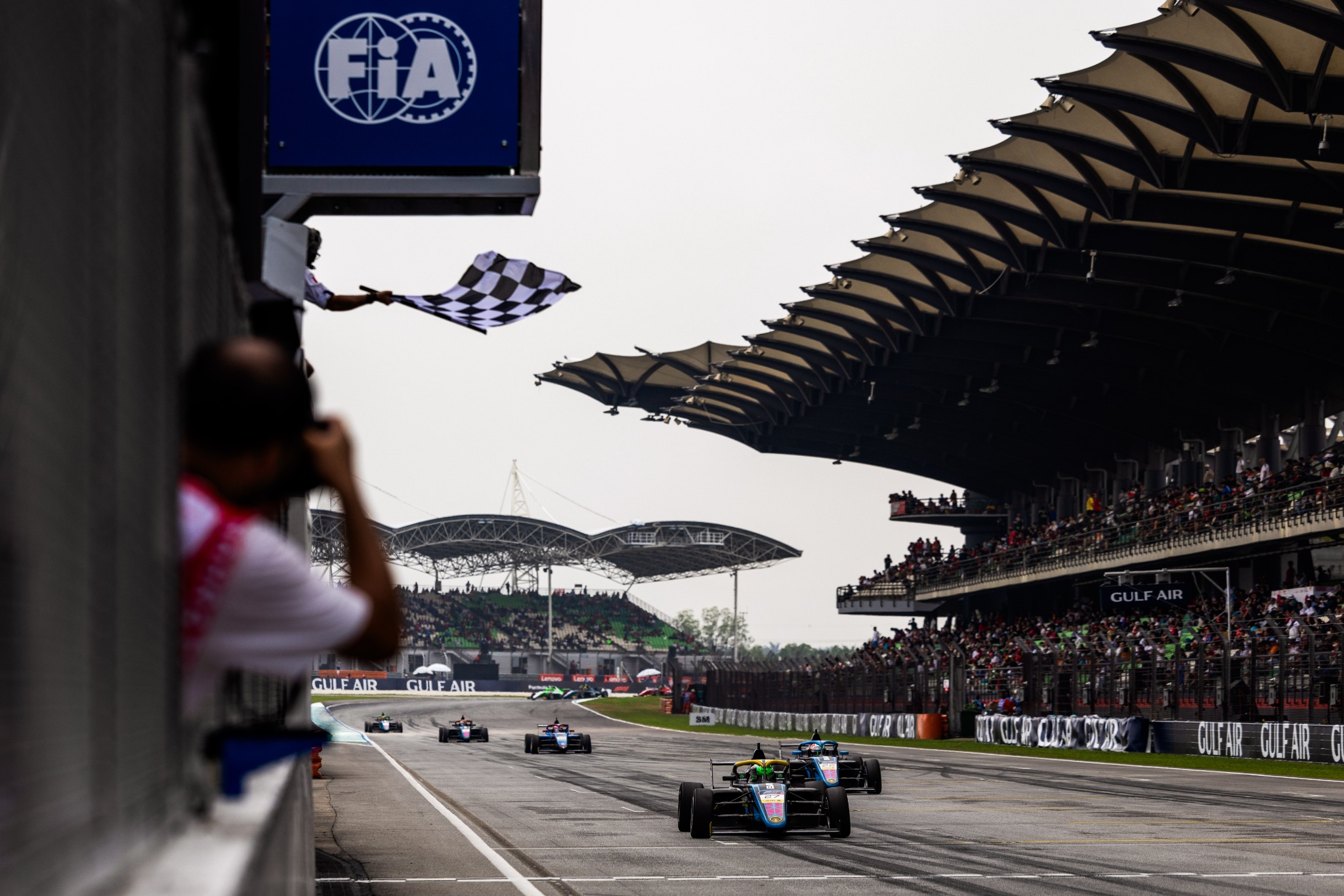 An Evans GP Formula 4 car racing at Sepang on Grand Prix Sunday